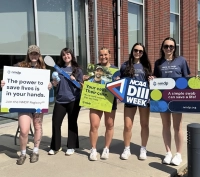 group of students holding d3 signs
